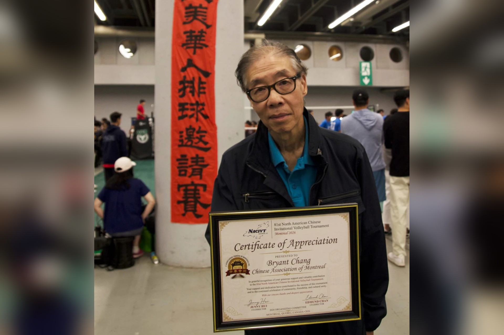 Bryant Chang of the Chinese Association of Montreal holding a Certificate of Appreciation at the 81st NACIVT