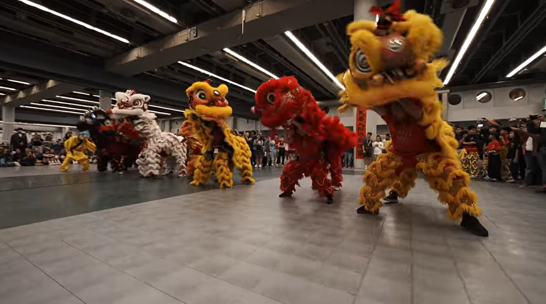 Chan Lion Dance Club and Montreal Chinese Lion Dance Club lions performing together at the 81st NACIVT opening ceremony