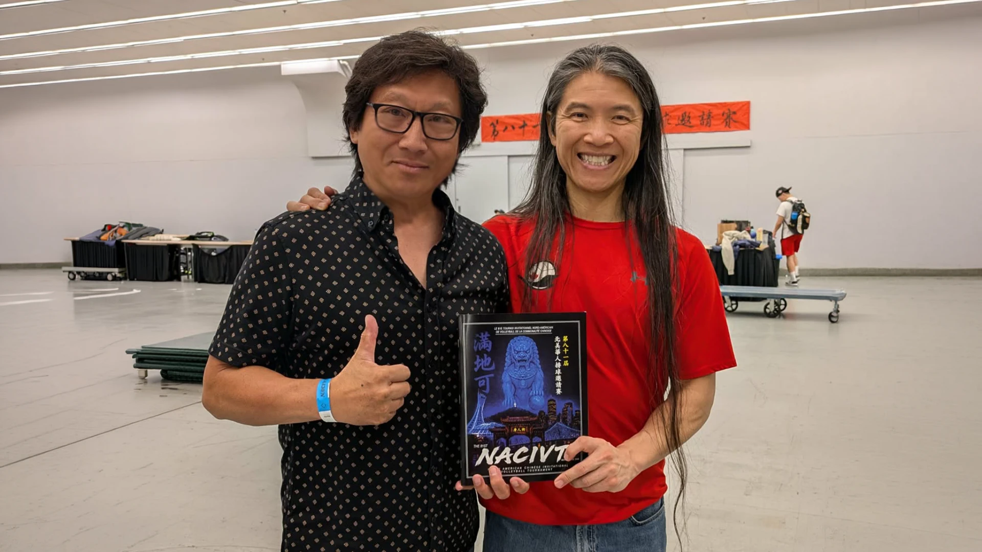 Holding the official 81st NACIVT Montreal tournament program book